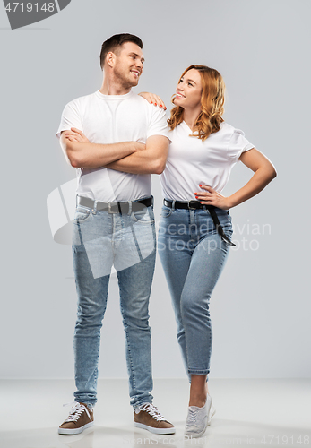 Image of portrait of happy couple in white t-shirts