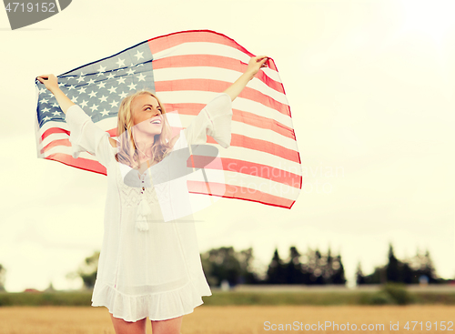 Image of happy woman with american flag on cereal field