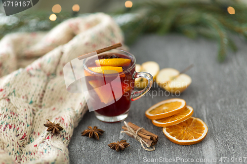 Image of glass of hot mulled wine with orange and cinnamon