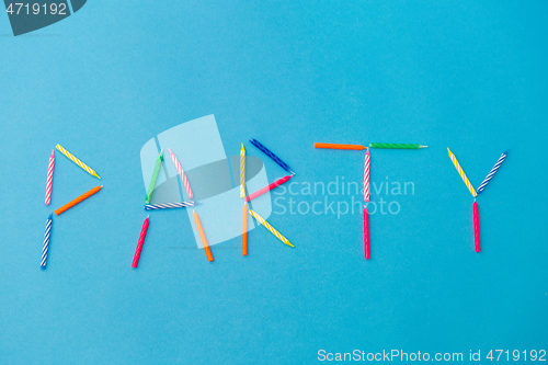 Image of word party made of birthday candles on blue