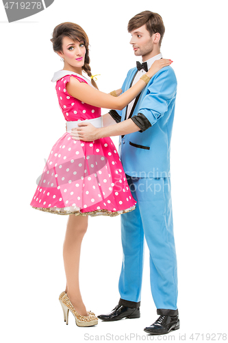 Image of doll looking boy and girl