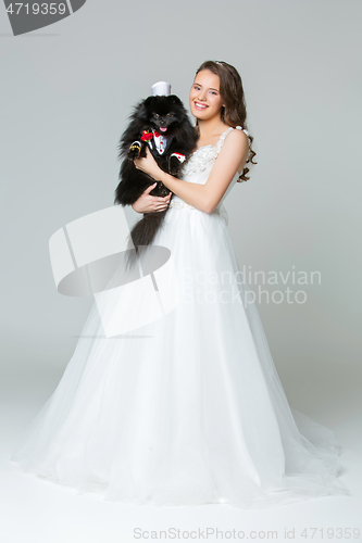 Image of bride girl with spitz goom in wedding suit