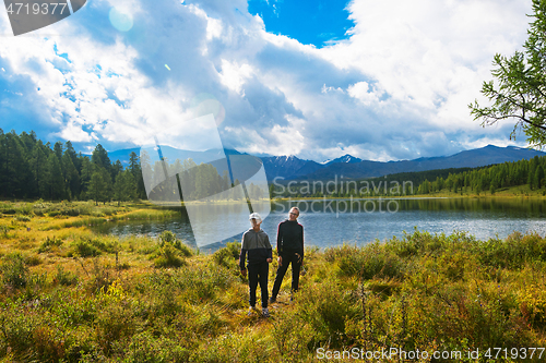 Image of Woman with boy Lake in the Altai Mountains