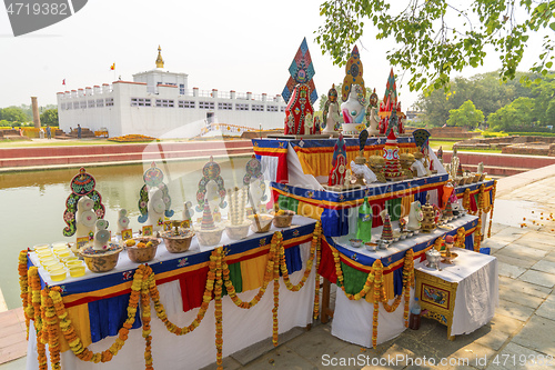 Image of Buddha birthplace in Lumbini and buddhist offerings 