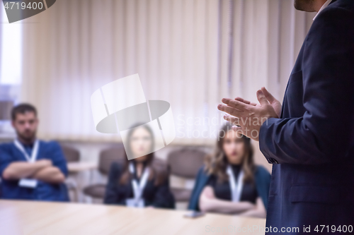 Image of businessman giving presentations at conference room