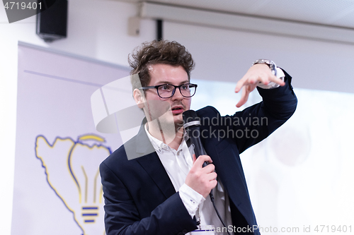 Image of businessman giving presentations at conference room