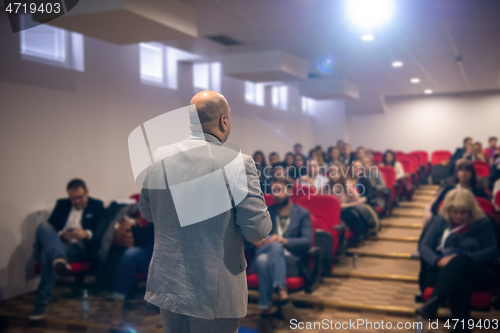 Image of businessman giving presentations at conference room