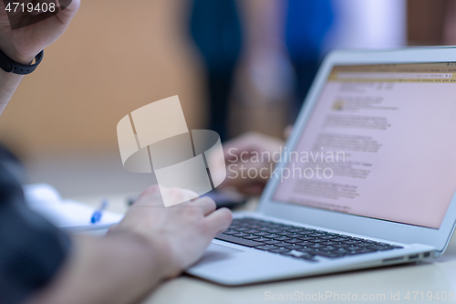 Image of business people hands using laptop computer