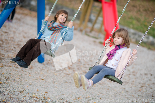 Image of kids swing in the park