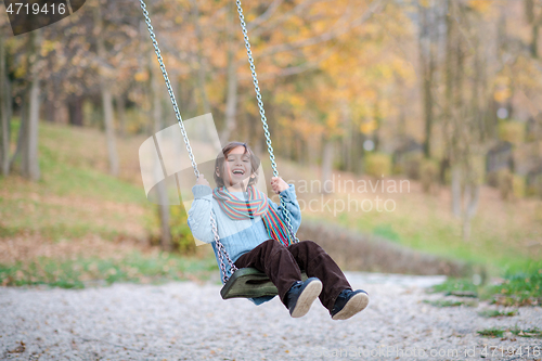 Image of kids swing in the park