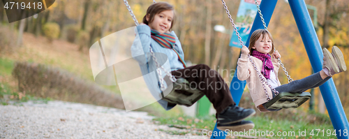 Image of kids swing in the park