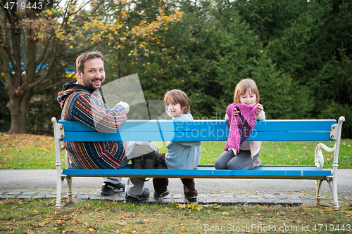 Image of father and  child having fun together  in park