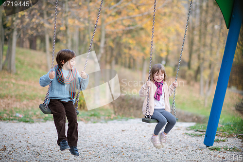 Image of kids swing in the park