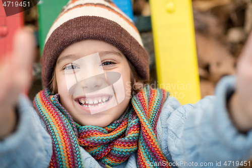 Image of cute little boy having fun in playground