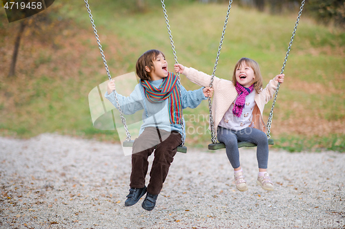 Image of kids swing in the park