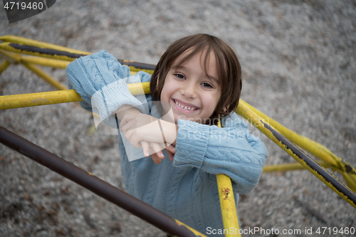 Image of cute little boy having fun in playground