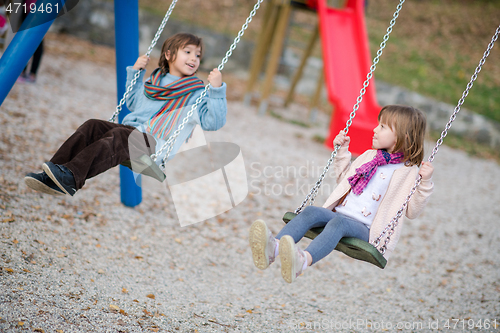 Image of kids swing in the park