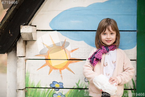 Image of cute little girl  having fun in playground