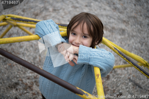 Image of cute little boy having fun in playground