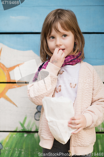 Image of cute little girl  having fun in playground