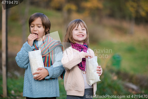 Image of kids in park eating popcorn in park