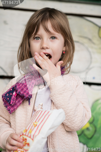 Image of cute little girl  having fun in playground