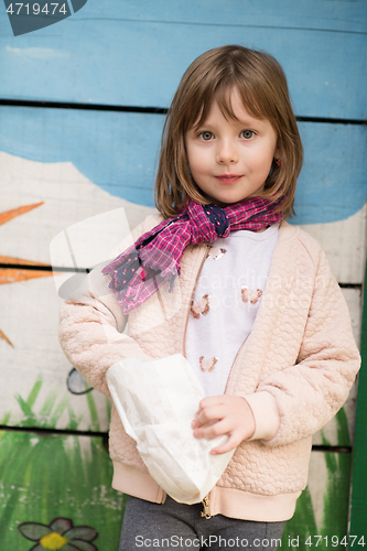 Image of cute little girl  having fun in playground