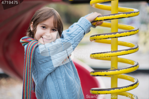 Image of cute little boy having fun in playground