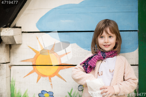 Image of cute little girl  having fun in playground