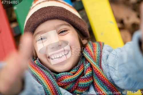 Image of cute little boy having fun in playground