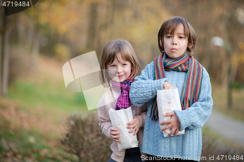 Image of kids in park eating popcorn in park