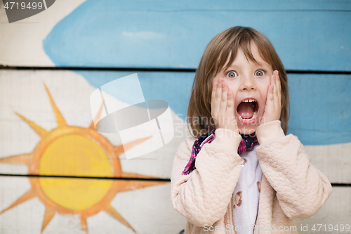 Image of cute little girl  having fun in playground