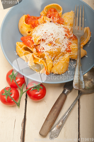 Image of Italian snail lumaconi pasta with tomatoes