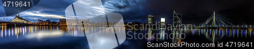 Image of Riga skyline with skyscrapers and suspension bridge