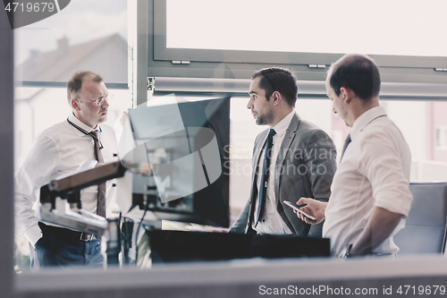 Image of Corporate businessteam working in modern office.