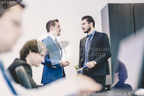 Image of Business people in modern office.