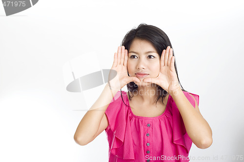 Image of young asian woman framed face