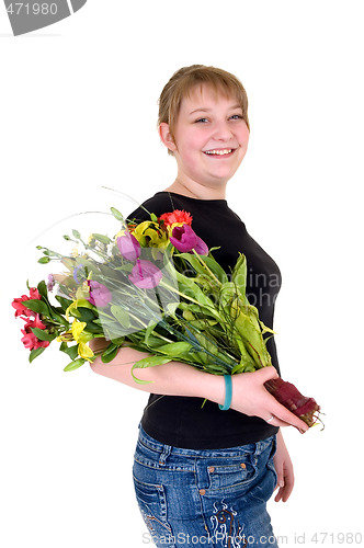 Image of Happy smiling young girl presenting flowers 