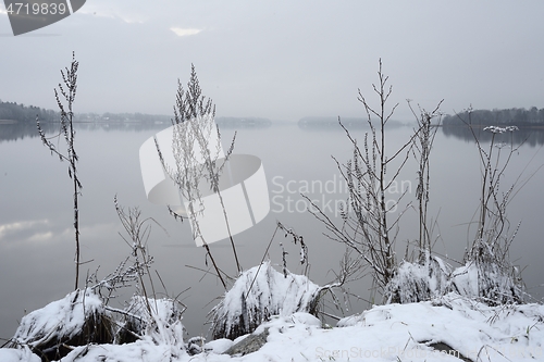 Image of lake shore at the beginning of winter in Finland