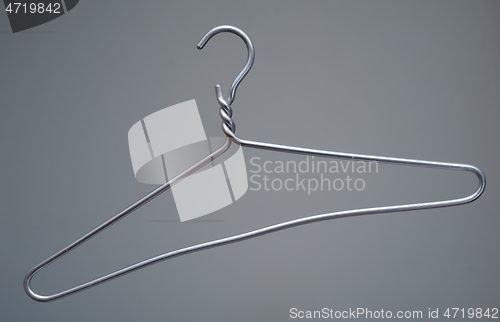 Image of simple metal hanger on a neutral 