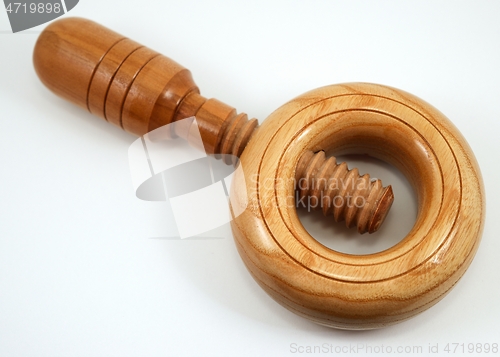 Image of traditional handheld wooden nutcracker on a white