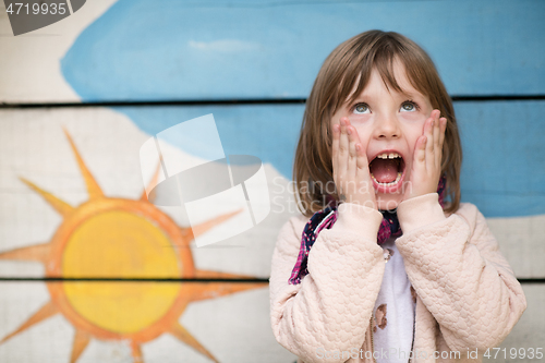 Image of cute little girl  having fun in playground