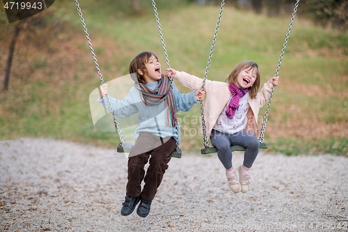 Image of kids swing in the park