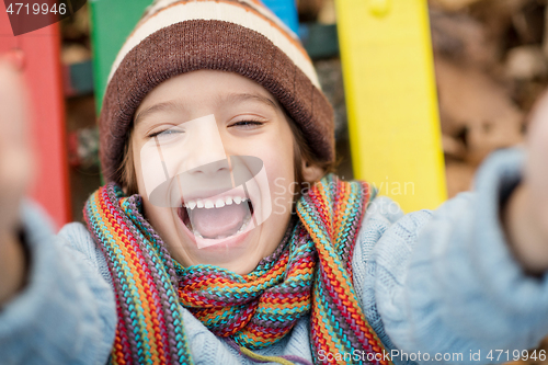 Image of cute little boy having fun in playground