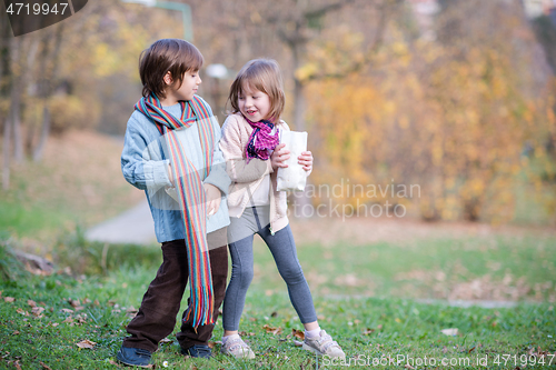 Image of kids in park eating popcorn in park