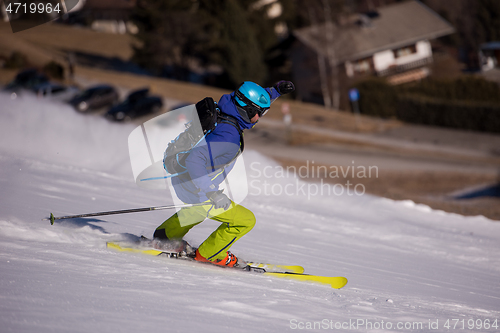 Image of Skier having fun while running downhill