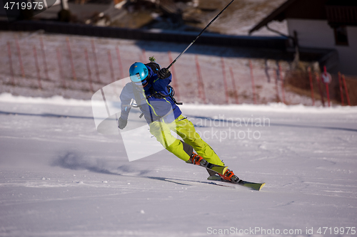 Image of Skier having fun while running downhill