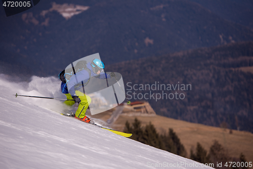 Image of Skier having fun while running downhill