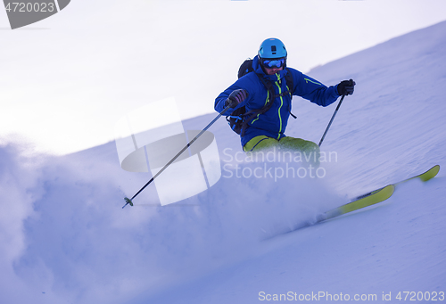 Image of Skier having fun while running downhill