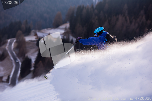 Image of Skier having fun while running downhill